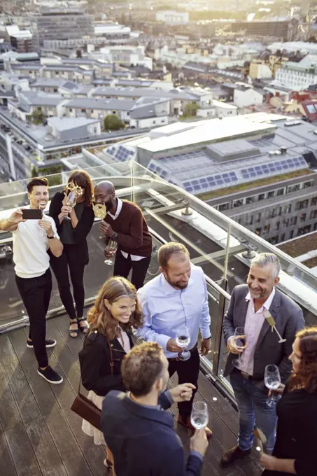 High angle view of business coworkers enjoying at office party after work