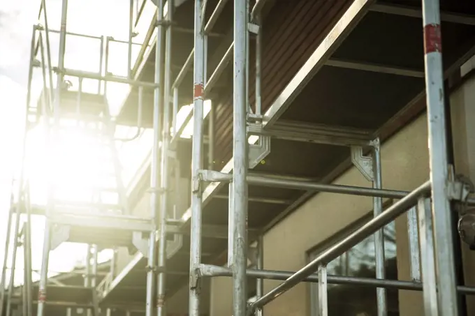 Low angle view of scaffolding outside house on sunny day