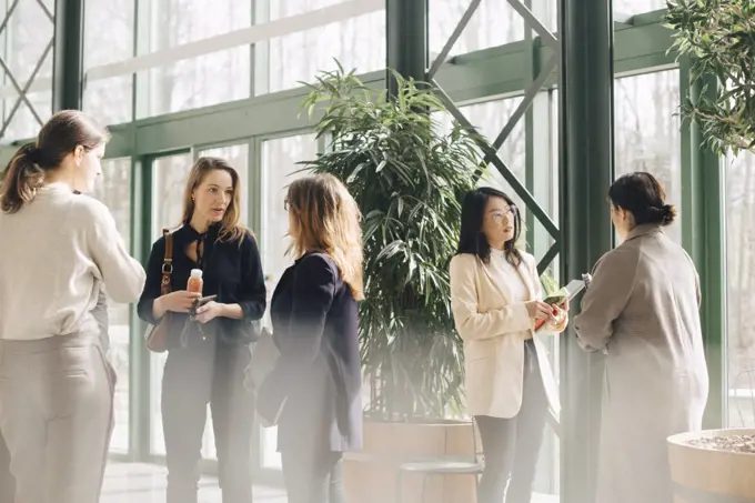 Multi-ethnic businesswomen networking in conference event