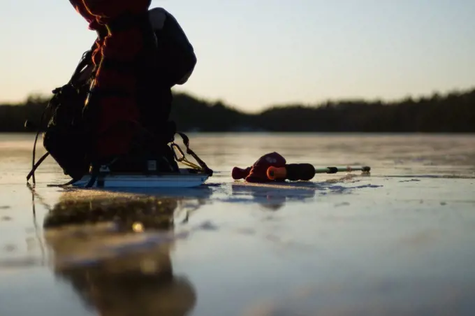 Close-up of ice-skater on lake