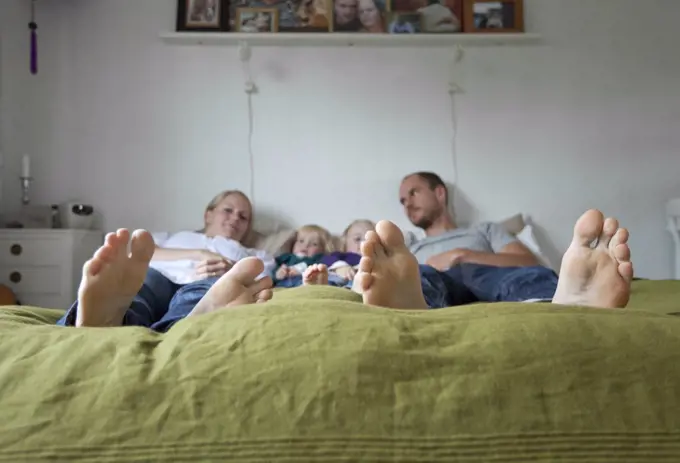 Family in green bed