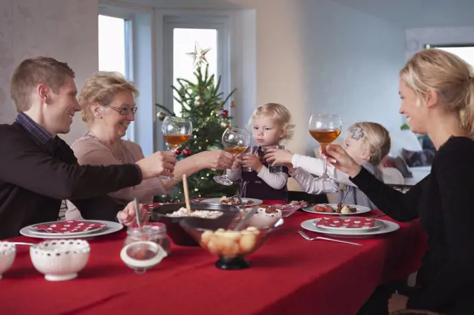 Family having a drink at dinner table