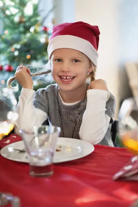 Happy girl with christmas hat