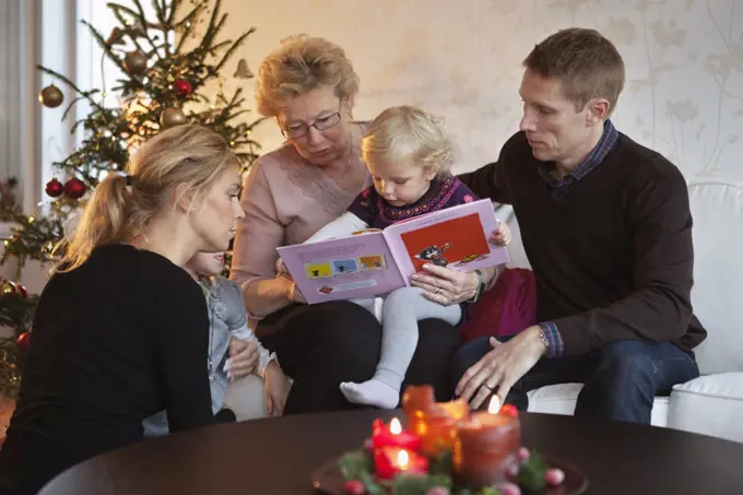 Family readig a book