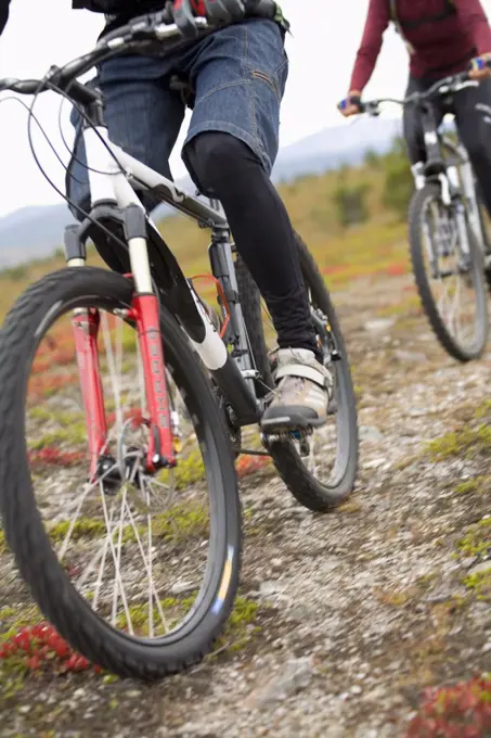 Two persons biking