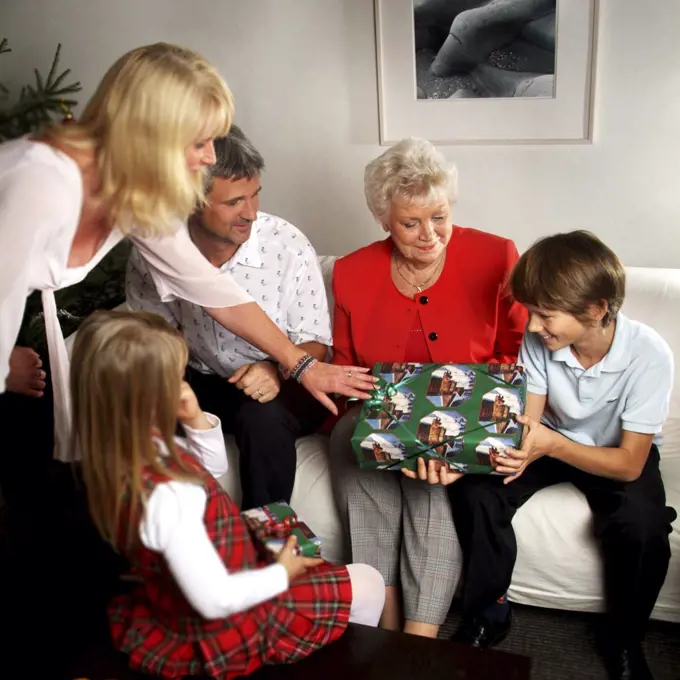 Family opening Christmas gifts on Christmas eve