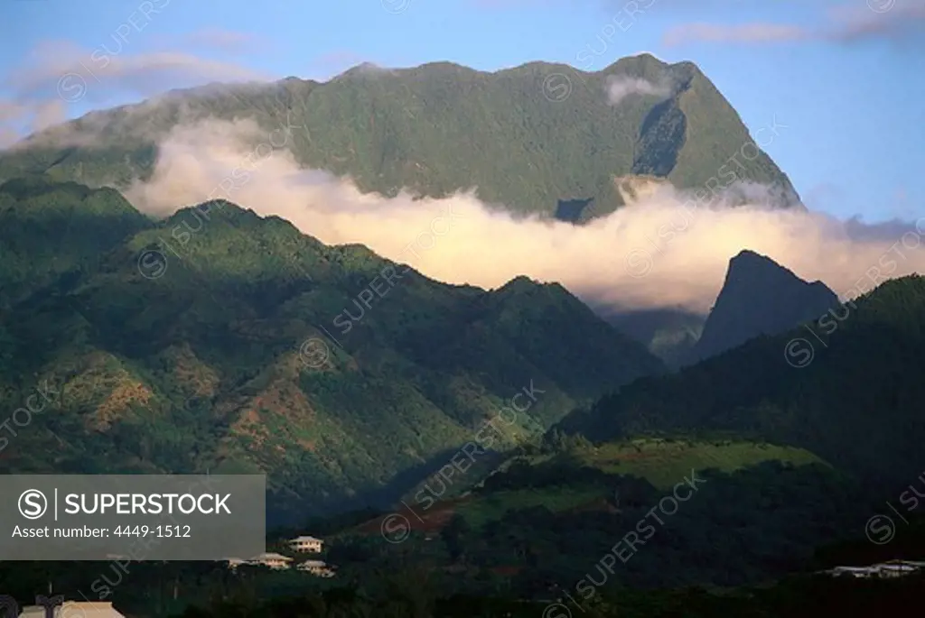 Mountain peaks above clouds in the sunlight, Tahiti, French Polynesia, Oceania