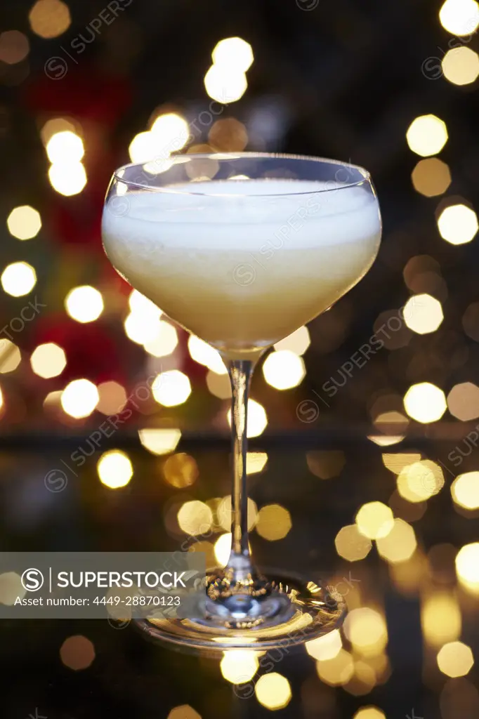 Fruity festive Christmas martini cocktail served in a rounded martini glass