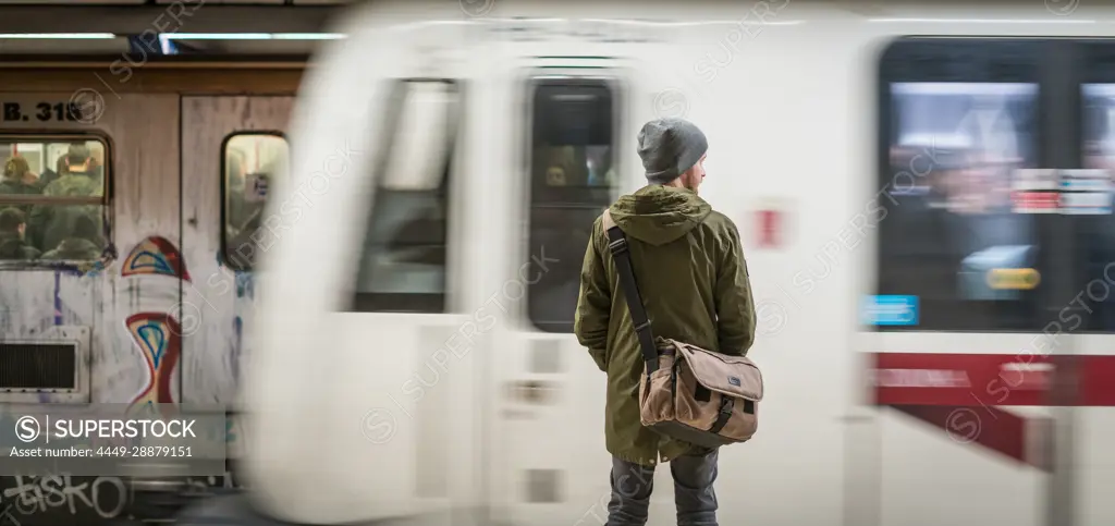 Tourist waits for the metro in Rome, Italy