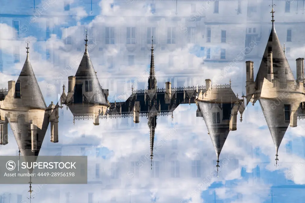 Rooftops and towers of the buildings along the Quai de la Mégisserie in Paris, France.