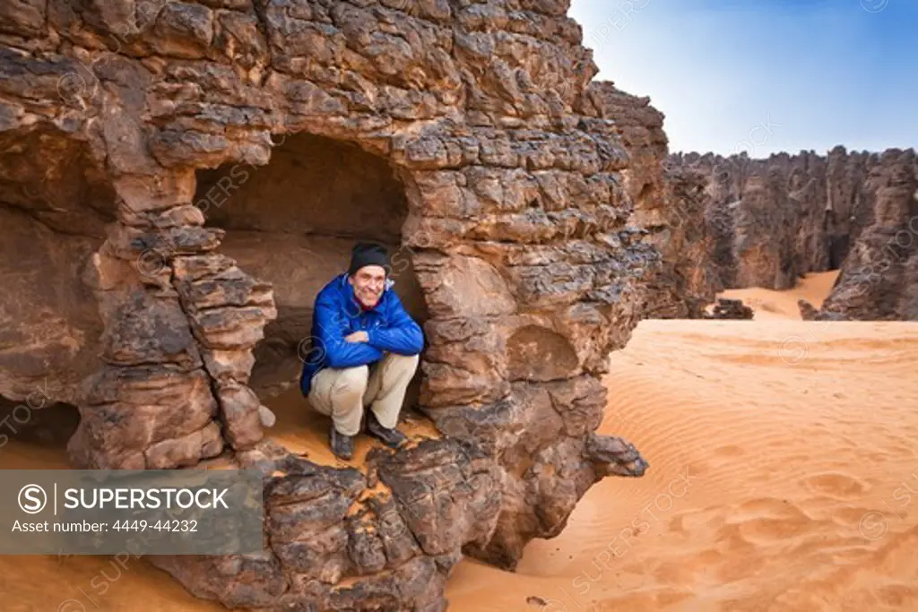 Tourist in the stony desert, Tassili Maridet, Libya, Sahara, Africa