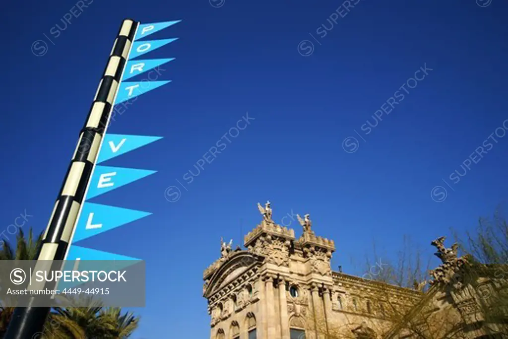 Flags and building under blue sky, Port Vell in Barcelona, Spain, Europe