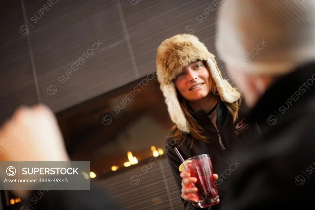 Woman with a drink in Cypress Creek Day Lodge, Cypress Provincial Park, British Columbia, Canada