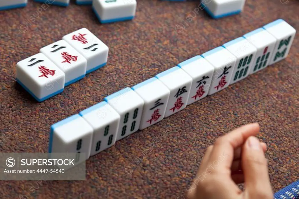 Women playing Majiang, Mahjong, Chinese board game, on the street, Chongqing, People's Republic of China