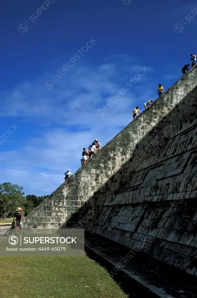 People climbing on a Maya temple, Castillo, Chichen Itza, Yucatan, Mexico, America