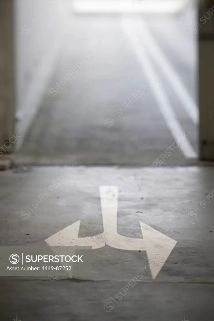 Arrows on ground of an underground garage