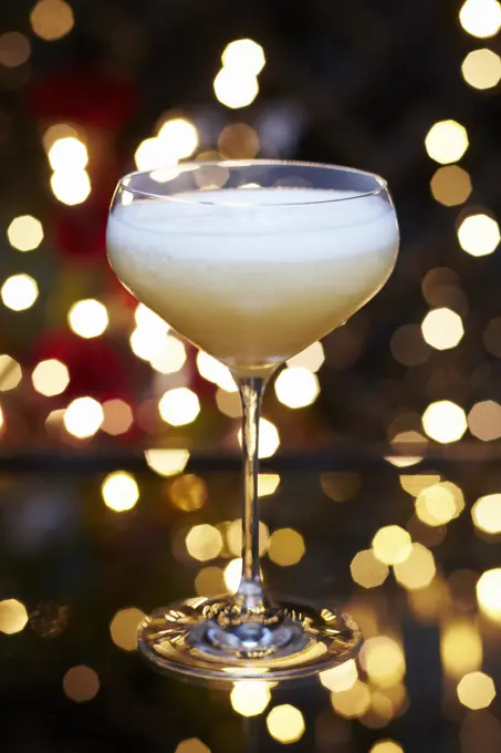 Fruity festive Christmas martini cocktail served in a rounded martini glass