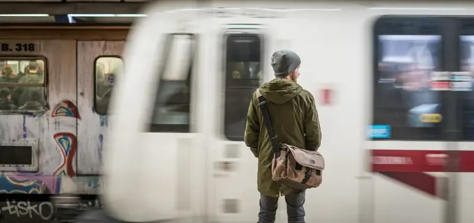 Tourist waits for the metro in Rome, Italy