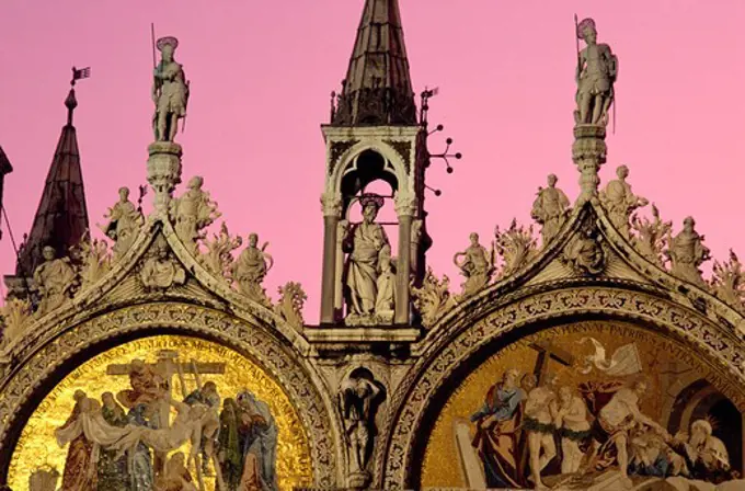 Statues and mosaic at St. Marc's basilica in the afterglow, Venice, Italy, Europe