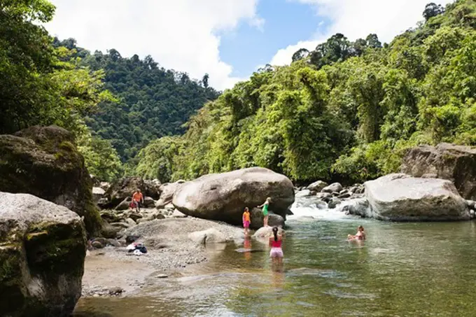 Tourists at Orosi river, rainforest, Tapanti National Park, Costa Rica