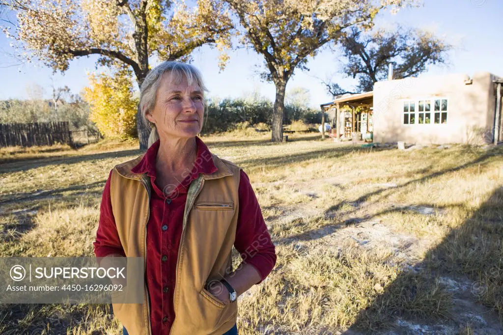 Mature woman at home on her property in a rural setting