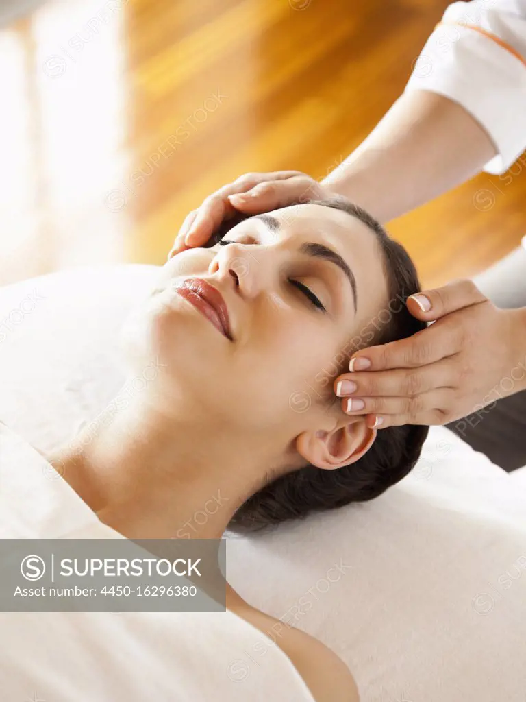 Overhead view of woman receiving scalp massage at a luxury resort and spa in Napa Valley, California