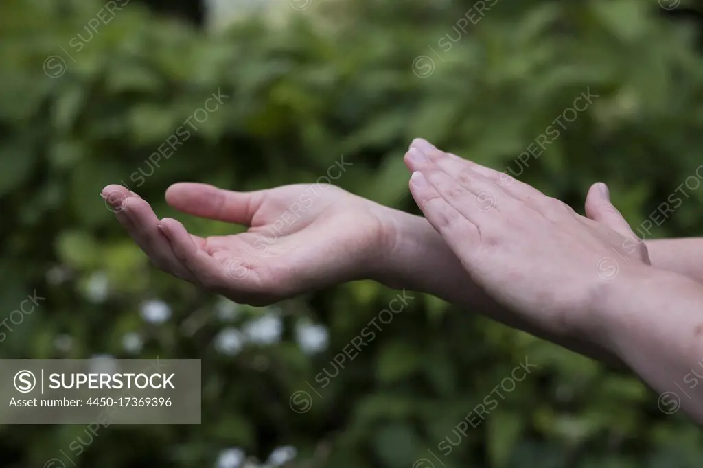 Close up of hands touching, EFT tapping therapy technique.