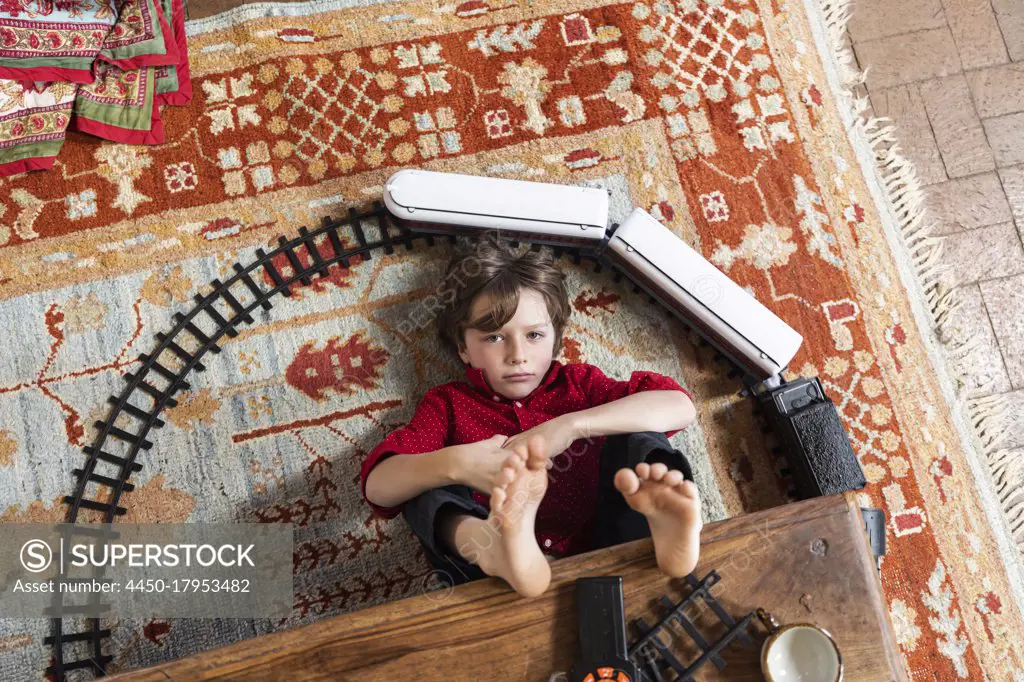 overhead view of young boy playing with his train