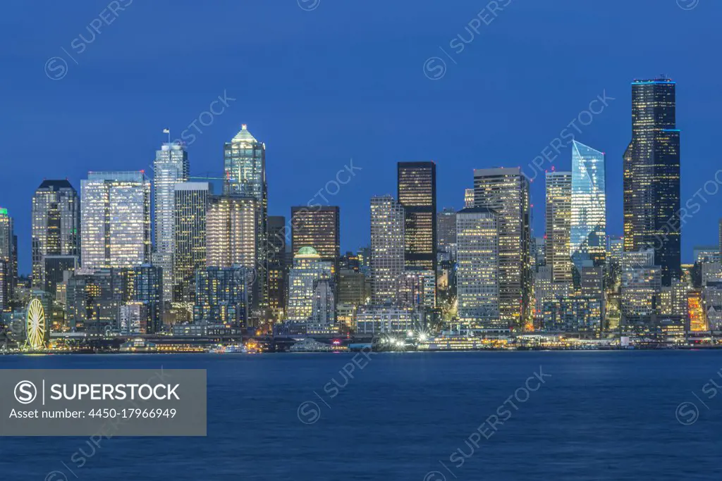 Seattle skyline, from Puget Sound, downtown buildings  at night. 