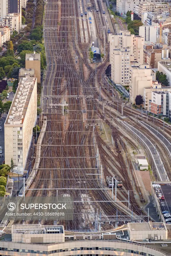 Aerial view of multiple train tracks running into Paris.