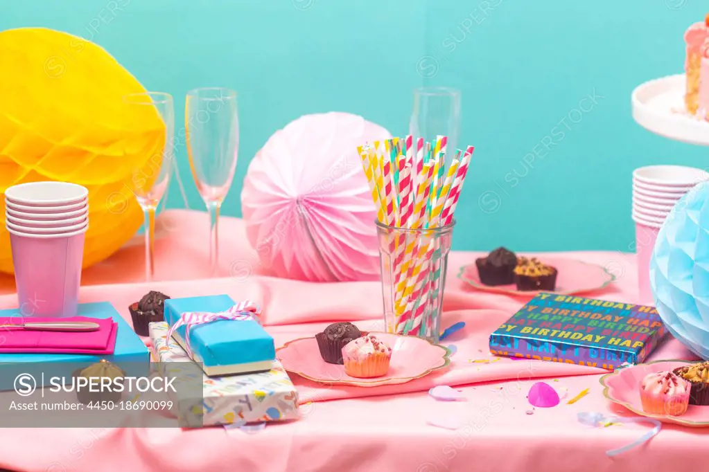 Birthday party table, with pink tablecloth