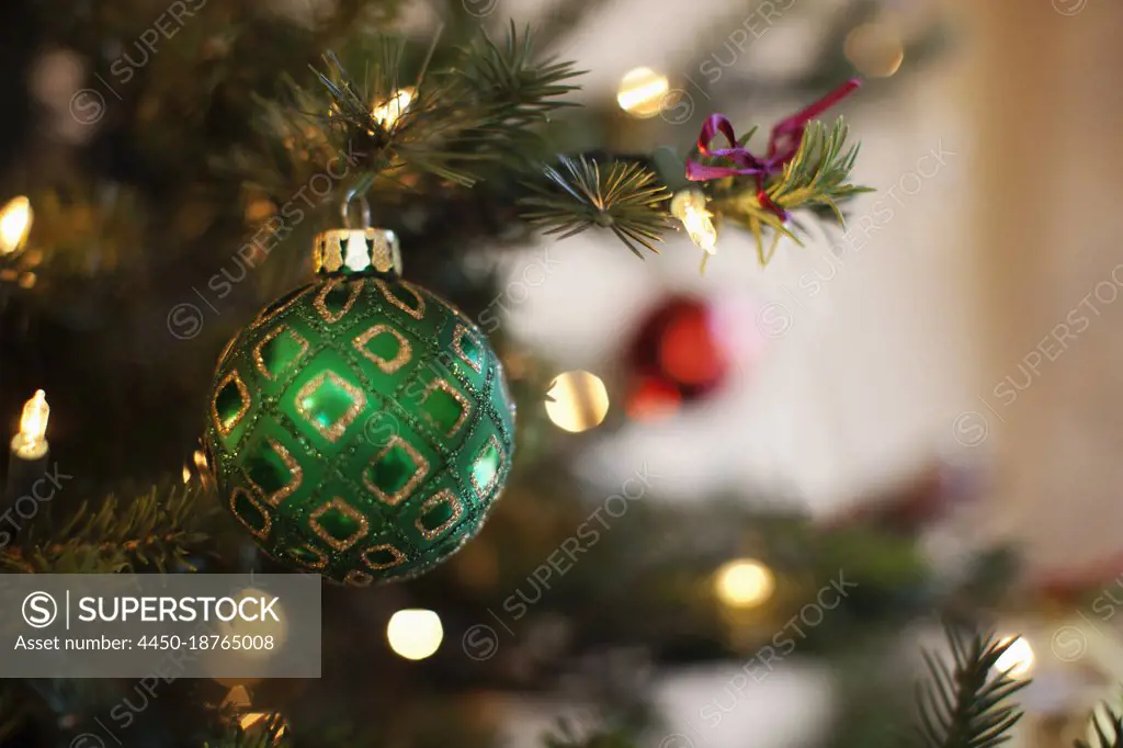 Close up of shiny green and red Christmas tree decorations, 