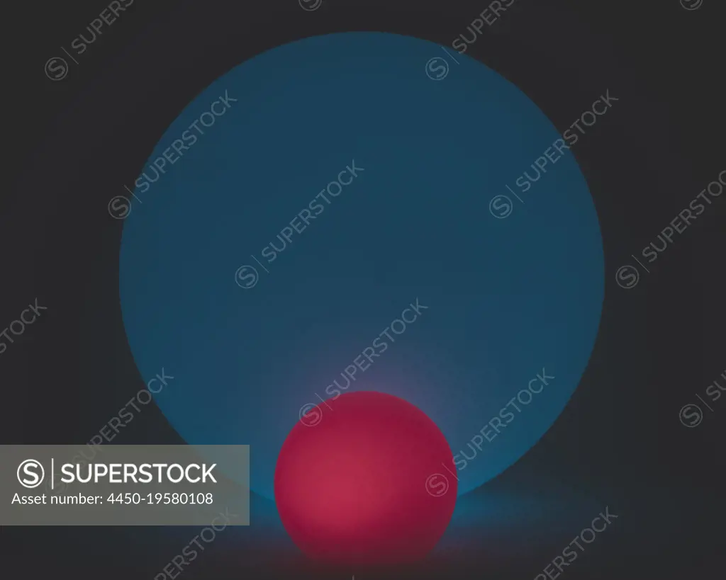 Glowing and illuminated spherical coloured orbs on a black background. 