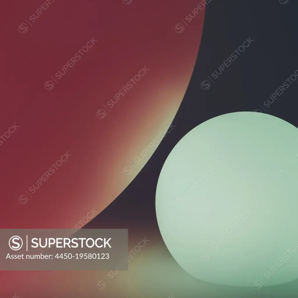 Glowing and illuminated spherical coloured orbs on a black background. 