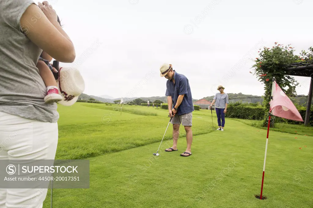 Family on a golf course.