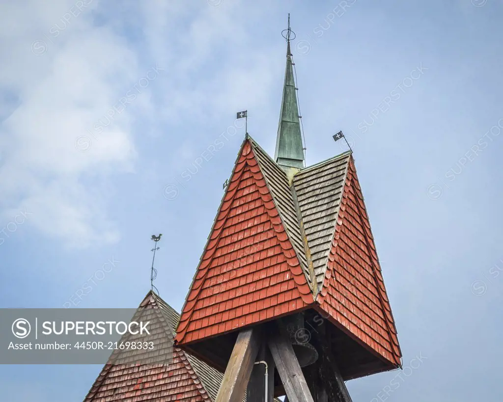 Close up of the roof and bell tower of a gabled roof in Copenhagen.