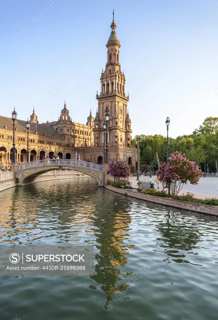 Plaza de Espana, a 20th century renaissance revival complex of buildings around a pool, with art deco aspects. Water and bridge. 