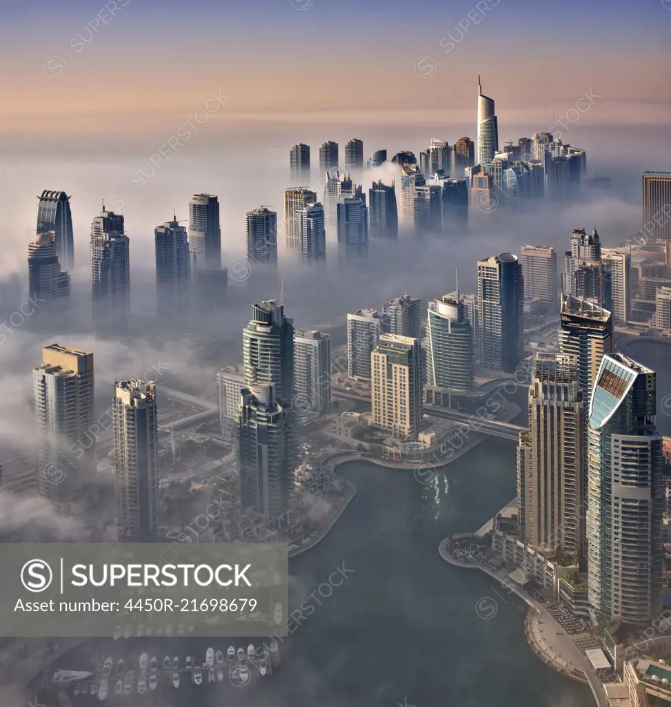 Aerial view of the cityscape of Dubai, United Arab Emirates, with the marina in the foreground.