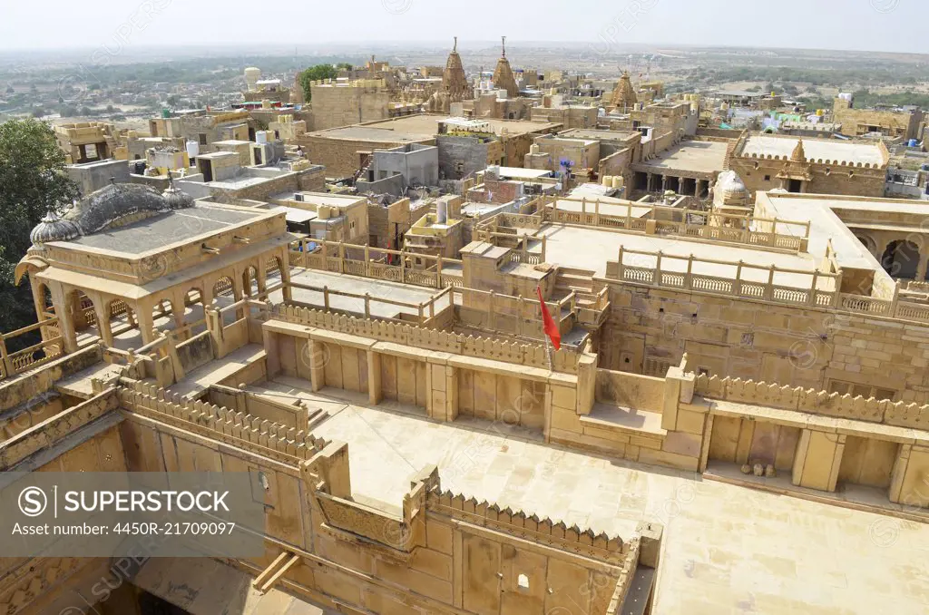 The historic hillfort sandstone buildings of Jaisalmer, elevated view of courtyards and rooftops.