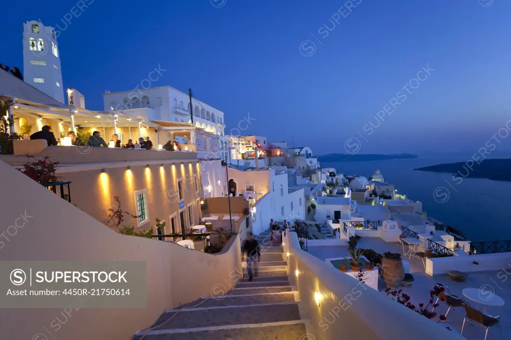 High angle view of traditional white washed houses on a Greek Island at dusk.