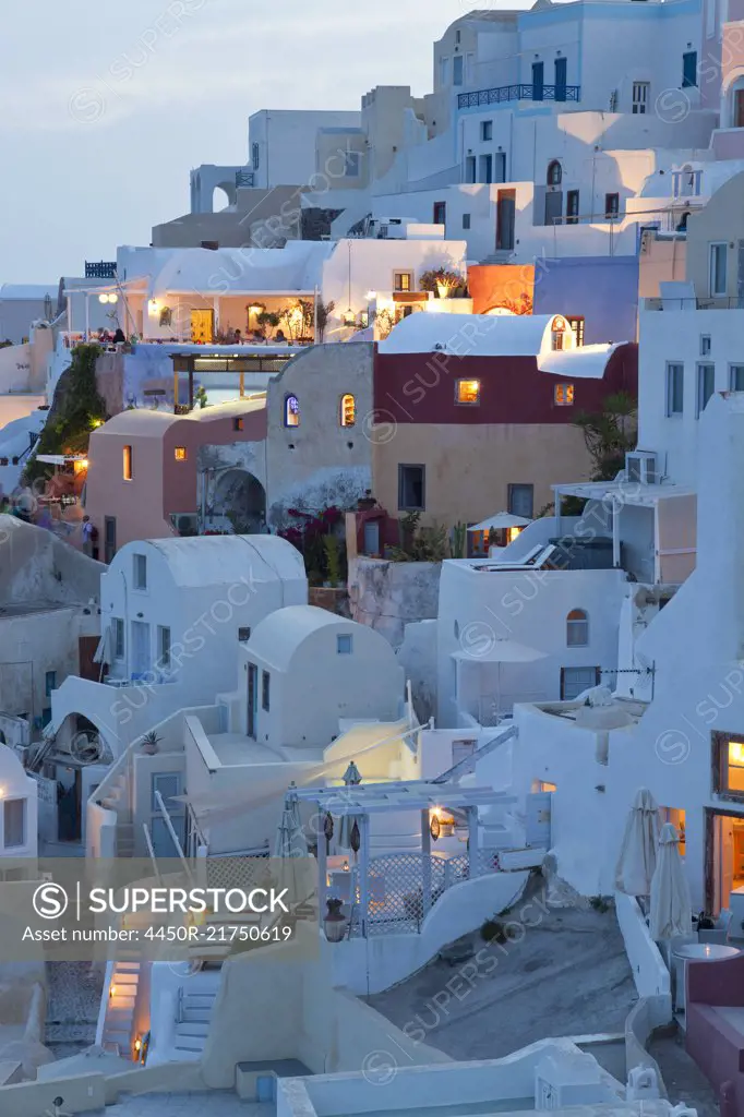 High angle view of traditional white washed houses on a Greek Island at dusk.