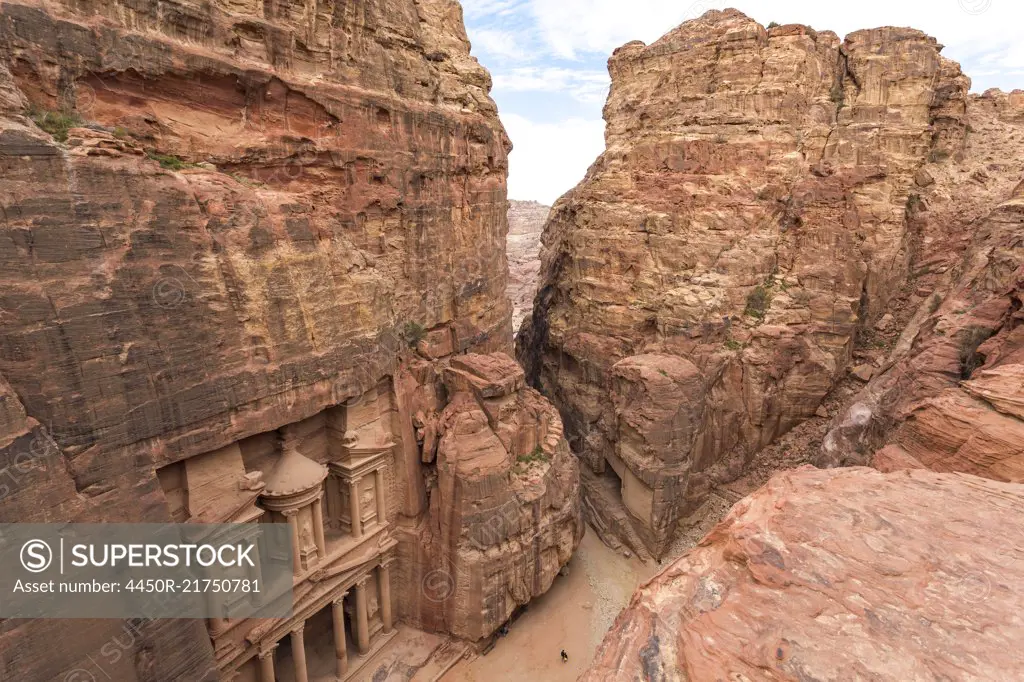 High angle exterior view of the rock-cut architecture of Al Khazneh or The Treasury at Petra, Jordan.