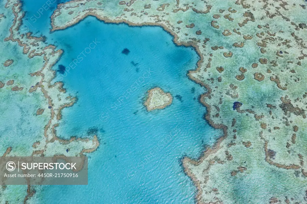 Aerial view of turquoise reef in the Pacific Ocean.