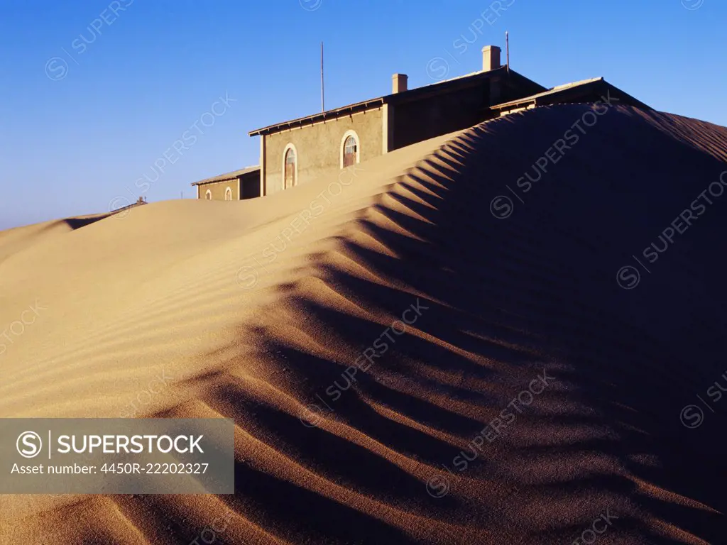 House Buried in Sand