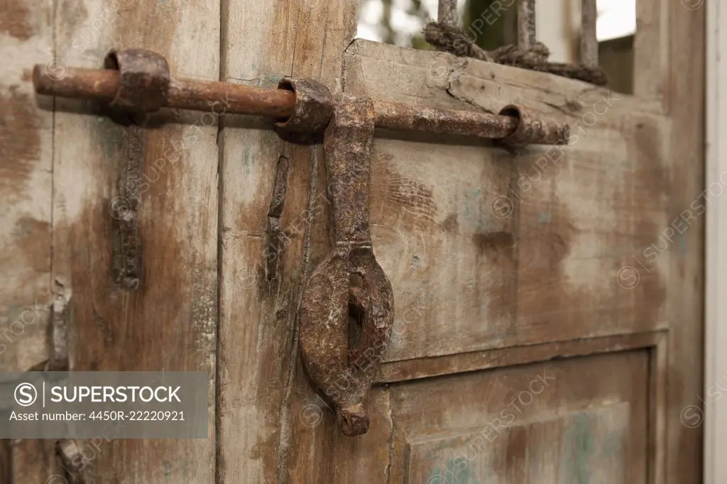 Old Iron Door Latch on Wooden Door