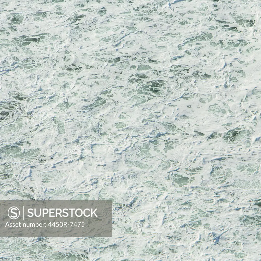 The surface of the Pacific ocean with wave patterns and white water, at Manzanita, Oregon.