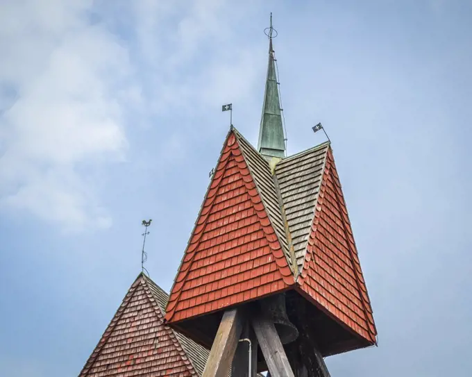 Close up of the roof and bell tower of a gabled roof in Copenhagen.