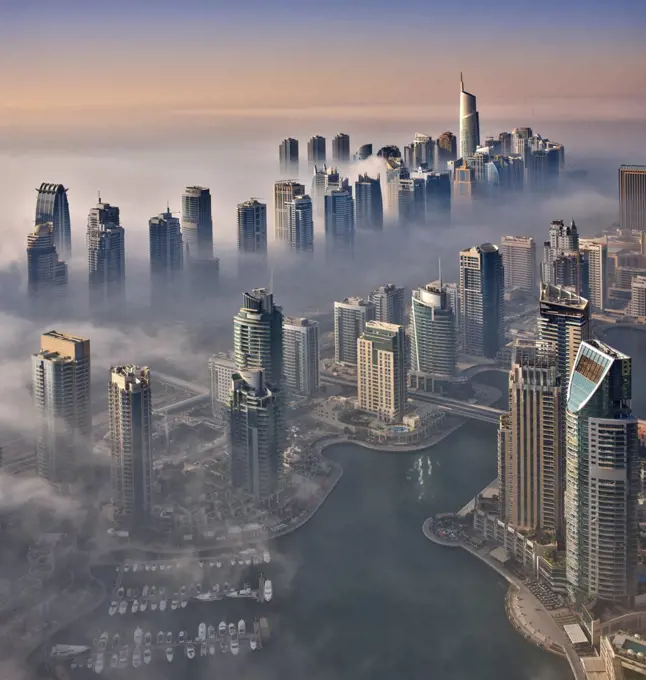 Aerial view of the cityscape of Dubai, United Arab Emirates, with the marina in the foreground.