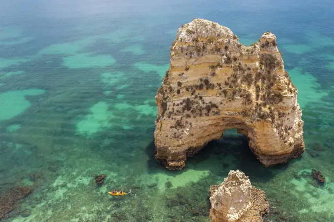 High angle view of rock formation in clear ocean.