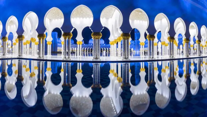 Blue and white Sheikh Zayed Mosque at dusk, Abu Dhabi, United Arab Emirates.